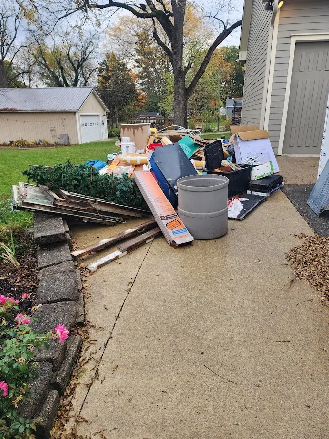 Dumpster being loaded with debris for Commercial Dumpster Rental in Lakeport